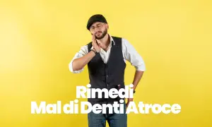 Uomo con cappello e occhiali che si tiene la guancia, soffre di un atroce mal di denti. Potrebbe essere utile il cortisone per mal di denti.