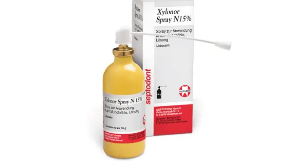 Flacone giallo con spray Xylonor N15% e scatola, per uso orale.