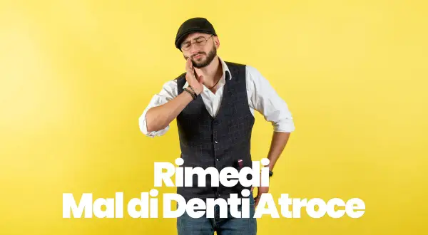 Uomo con cappello e occhiali che si tiene la guancia, soffre di un atroce mal di denti. Potrebbe essere utile il cortisone per mal di denti.