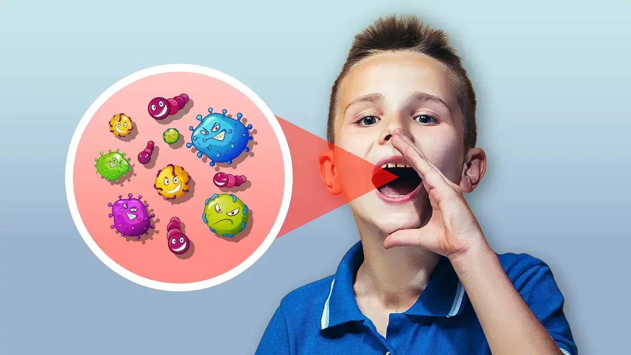Bambino con bocca aperta, da cui escono germi colorati. Un cerchio mostra la **disbiosi orale**, un disequilibrio di batteri.