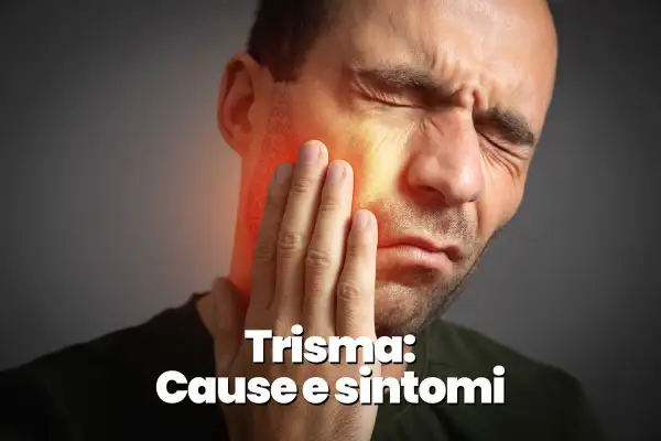 Uomo con mano sulla guancia, evidenziando il dolore alla mascella e le sue cause.